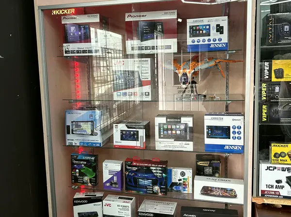 Car audio, security and screen equipment displayed inside the shop